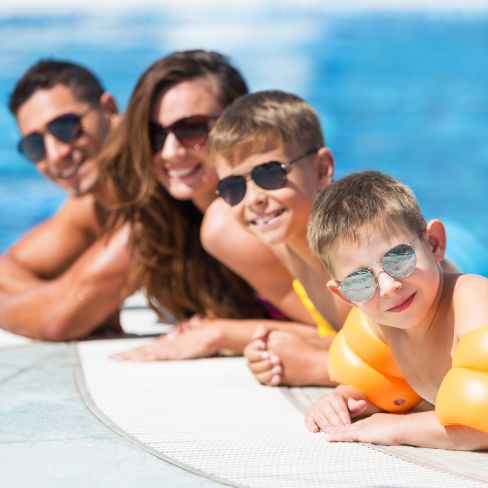 photo of a family in the pool